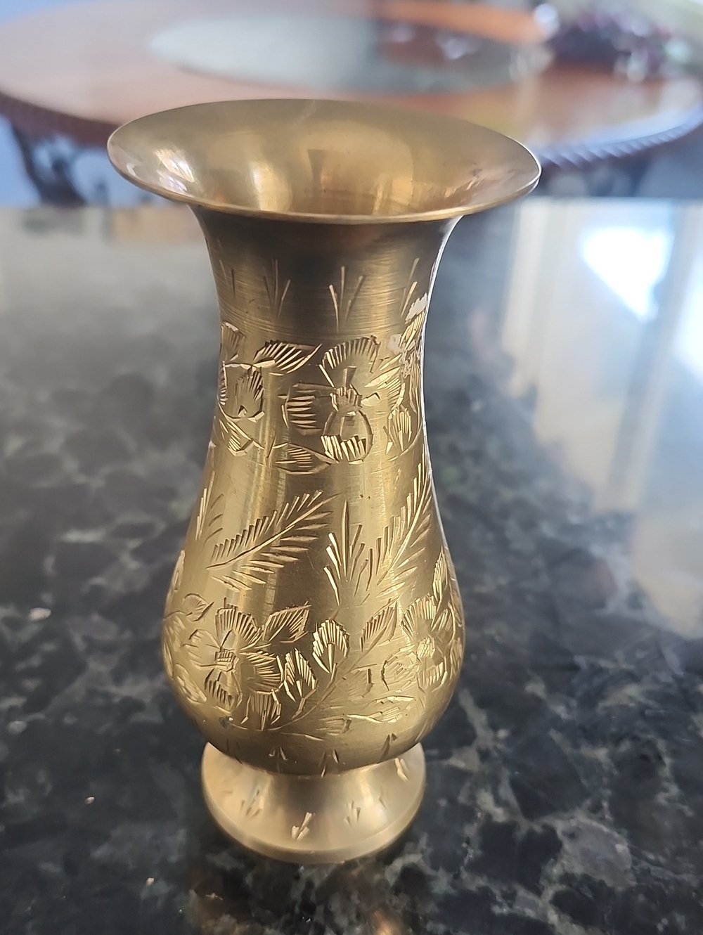 This is a vintage etched brass vase,  of Indian origin. 